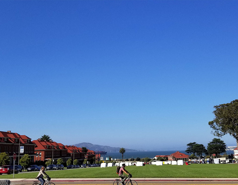 Photo of a biplane flying over the Presidio 1929