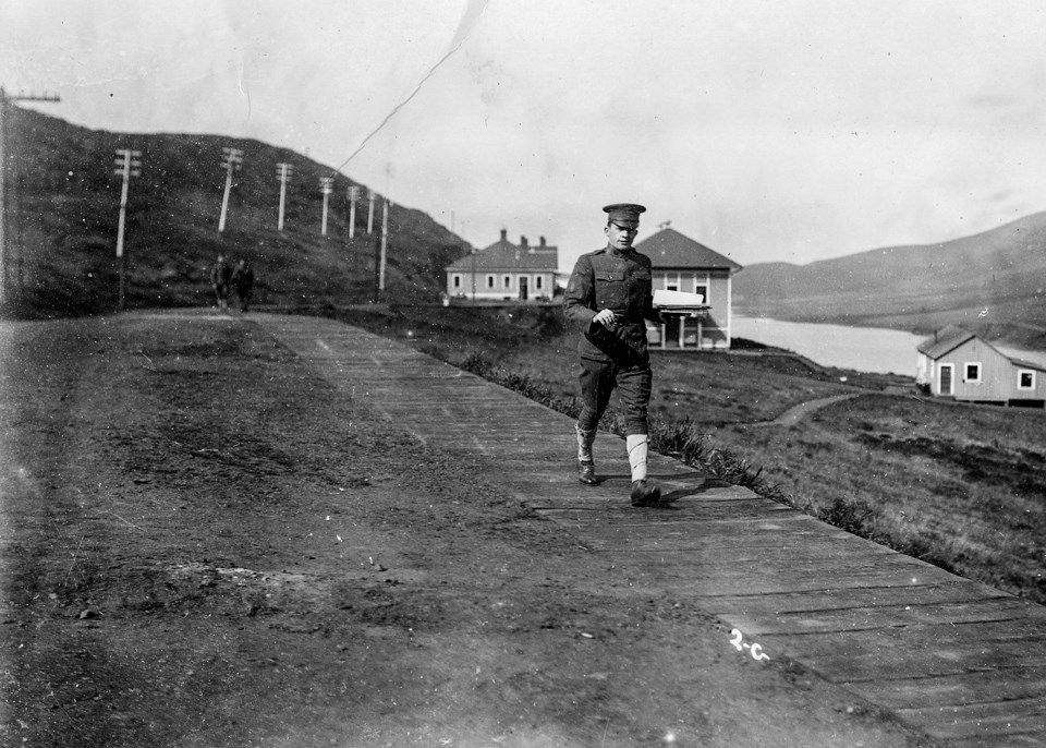 soldier walking on wooden walkway