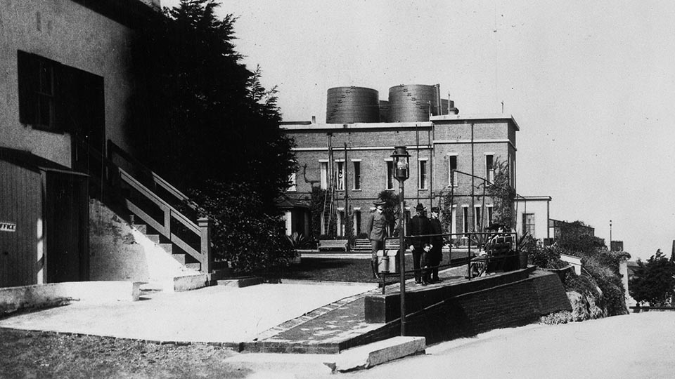 people walk outside of the cell house