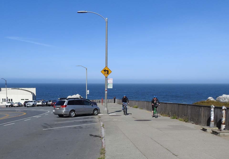 a parking lot along the ocean