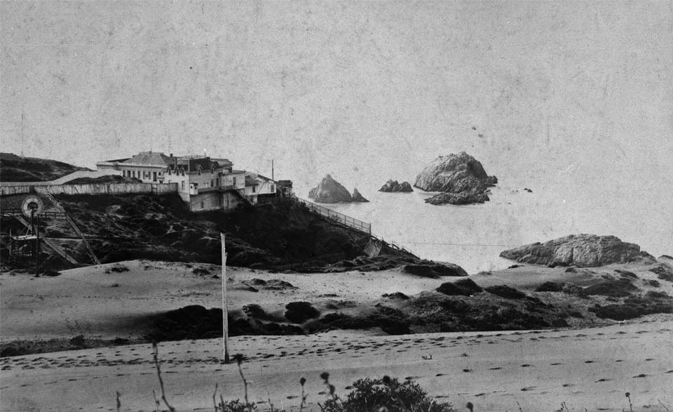 a house on a grassy hill