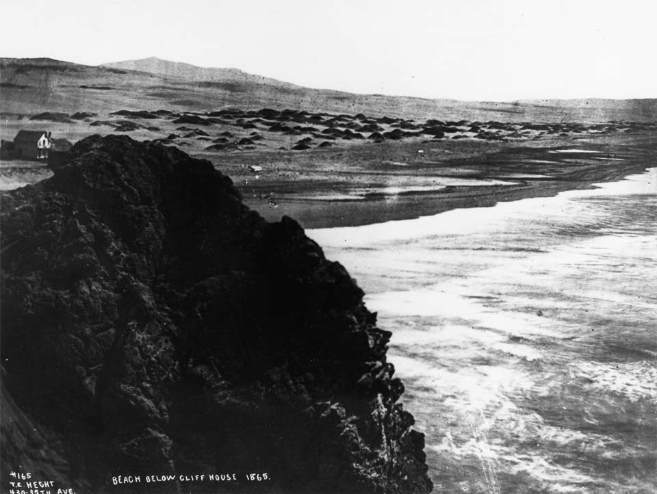 a rock overlooking the beach