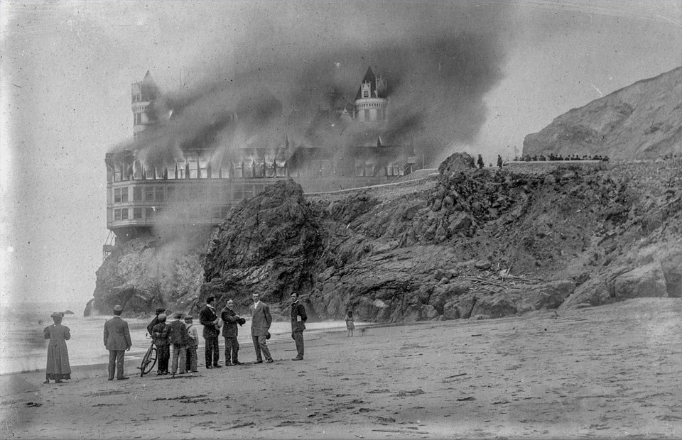 Photo of people watching 2nd Cliff House Fire from beach