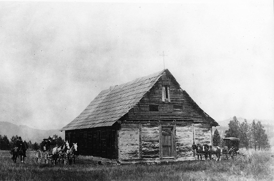 Visitors pose in front of St. Paul's Mission in 1888