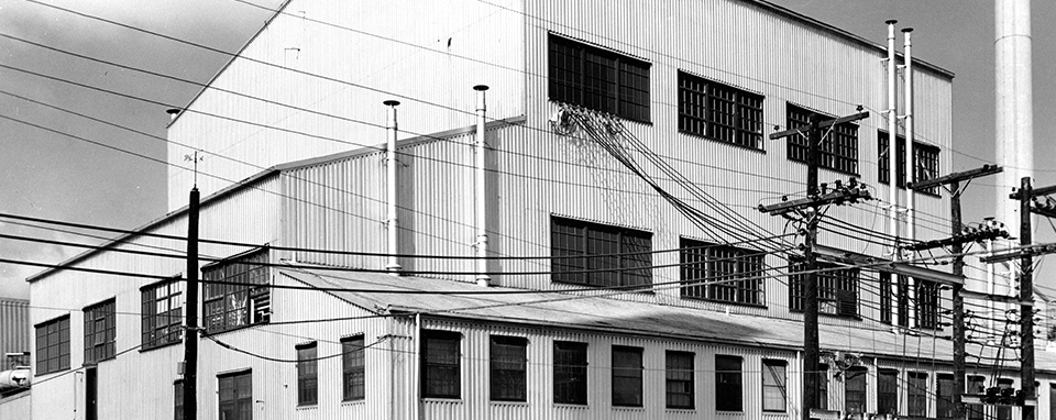 Large industrial building with many windows.