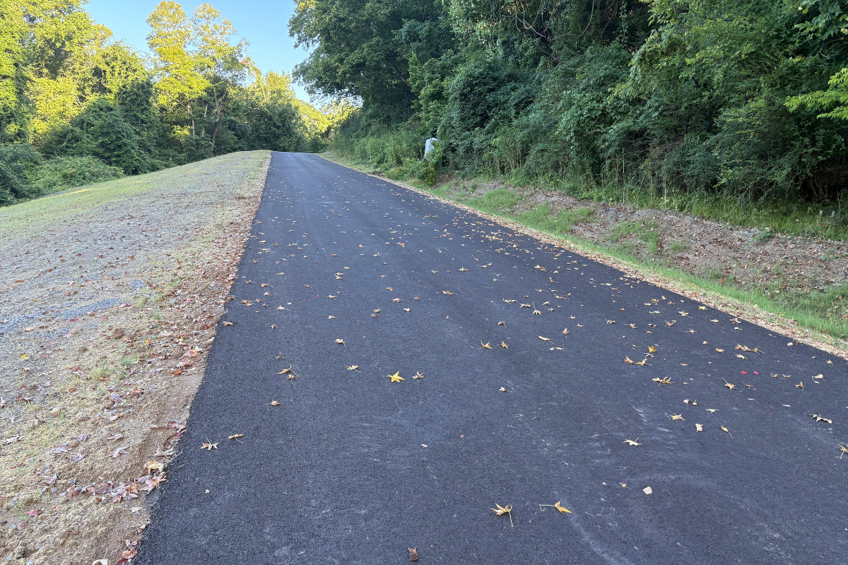 North Union Avenue before repairs, showing severely cracked, buckled, and collapsed pavement along a section of the roadway.