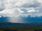rain squall over a mountain landscape