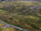 aerial view of a dirt road and equpiment in a tree-less landscape