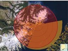 a satellite map with a large red circle showing plane travel distances in five minutes