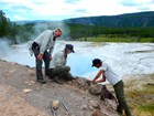 Interns working near river's edge