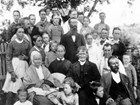 An extended multigenerational family poses during a picnic in 1878.