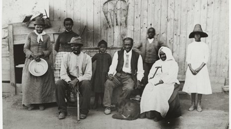 Tubman stands alongside her family members.