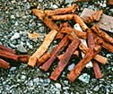 A pile of old, abandoned explosives are left on the ground.