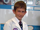 boy wearing lab coat
