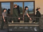 4 rangers walking through shoe cleaning station