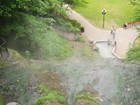 hot spring with pathway and visitors