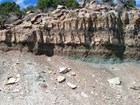 rock bluff with slope below
