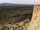 view from rock outcrop into lower basin
