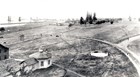 Black and white photo of fields and Vancouver Barracks in the 1880s.