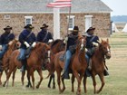 buffalo soldiers on horseback in reenactment  