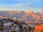 visitors on overlook of grand canyon