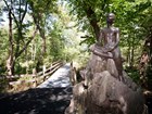 statue and forest trail