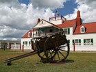 cart with visitor center in background