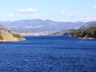 view across lake to low hills