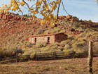 stone cabin on red rock slope