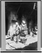 A man smokes a pipe in Rag Pickers Alley in Chinatown, SF. Collection Library of Congress.