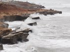 waves crashing on coastal bluffs