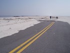 damaged road with sand overwash