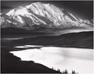 huge snowy mountain overlooking a calm lake