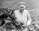 a woman holding rhubarb
