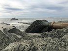 sand being pumped on to a beach