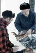 L. David Mech and Durward Allen examine a wolf kill in the 1960s. 