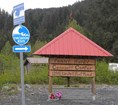 A sign for community center and tsunami escape route near Kenai Fjords National Park.