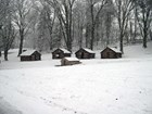 Reconstructed soldier cabins in the snow at Valley Forge. NPS Photo