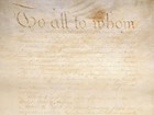 Detail, image of handwritten Articles of Confederation document, showing large text at top.