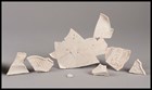 A line of ceramic shards with edging on them 