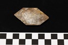 A pentagon shaped crystal object about an inch across. 