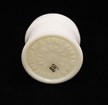 A ceramic object with “MODJESKA COLD CREAM, BUFFALO, NY” and “LARKING SOAP CO” embossed on it. 