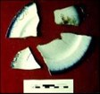 American shell-edged plate broken in 4 pieces.