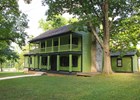Photo of a bright green, two story frame house, White Haven