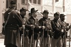 six men dressed as African American soldiers