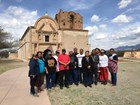 group photo of O'odham people standing in front of mission church