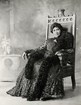 A woman sitting on a throne