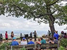 Ranger speaks with an audience at a scenic overlook