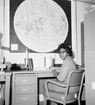 Woman sitting at a desk. 