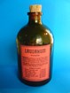 A small green glass bottle with a cork topper.